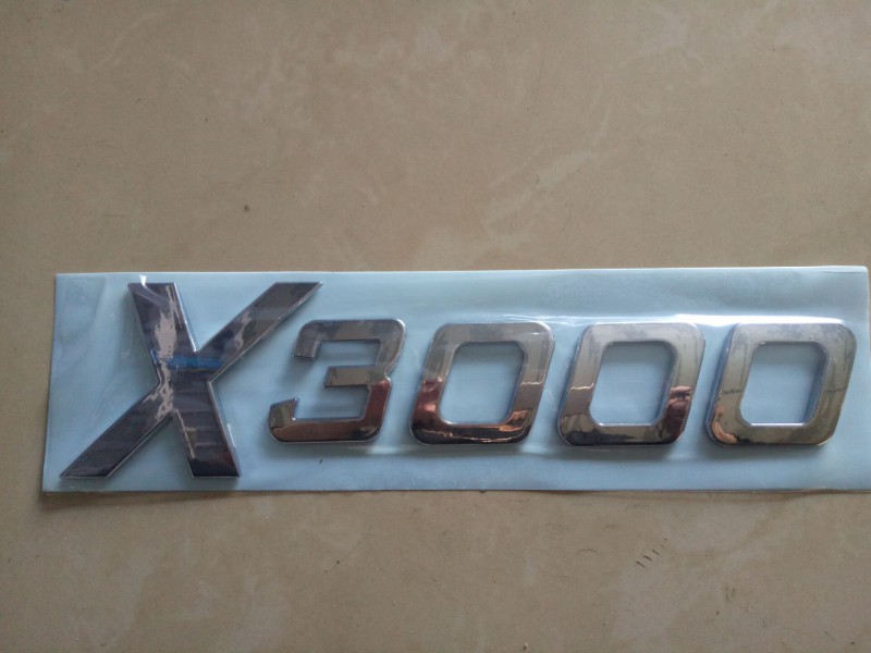 DZ14251950002,“X3000”标牌,济南尊龙(原天盛)陕汽配件销售有限公司